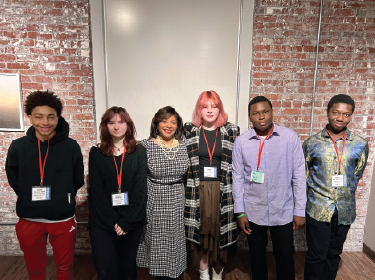 dr chapman standing with students
